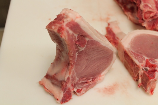 A noble, hand-cut pork chop.