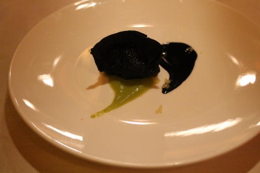 A crisp dumpling filled with whipped bacala, with squid ink and ginger.
